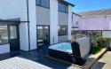 Holiday Let Spa 2 hot tub by a modern house
