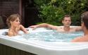 three people in a hot tub